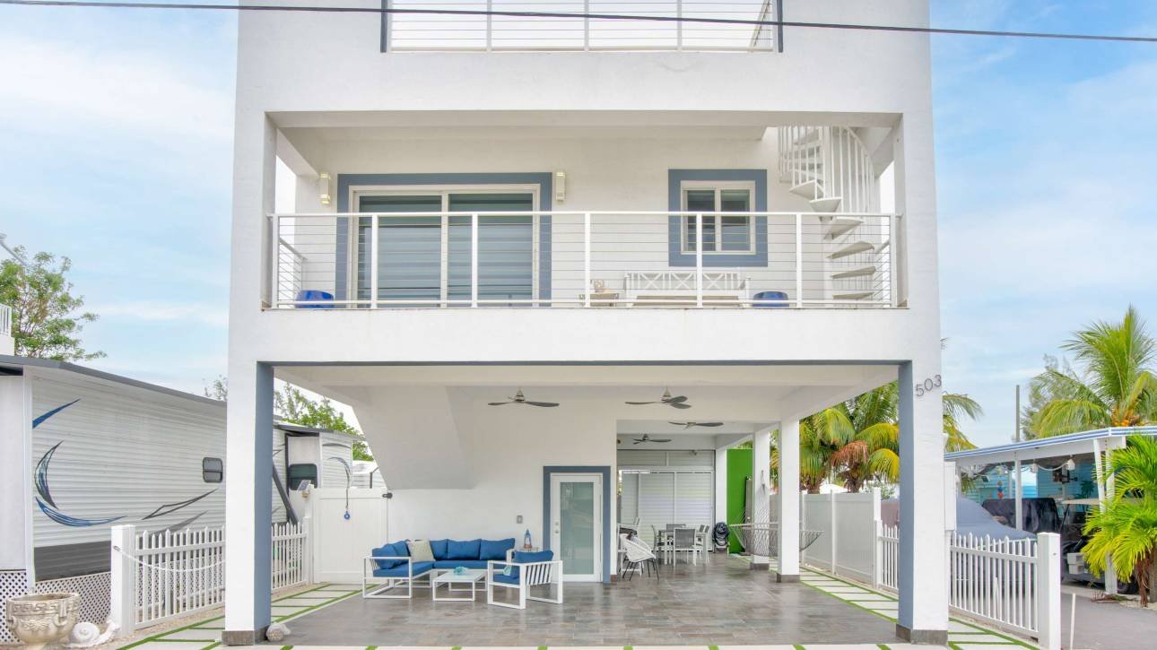 Modern two-story home with outdoor patio and garden design